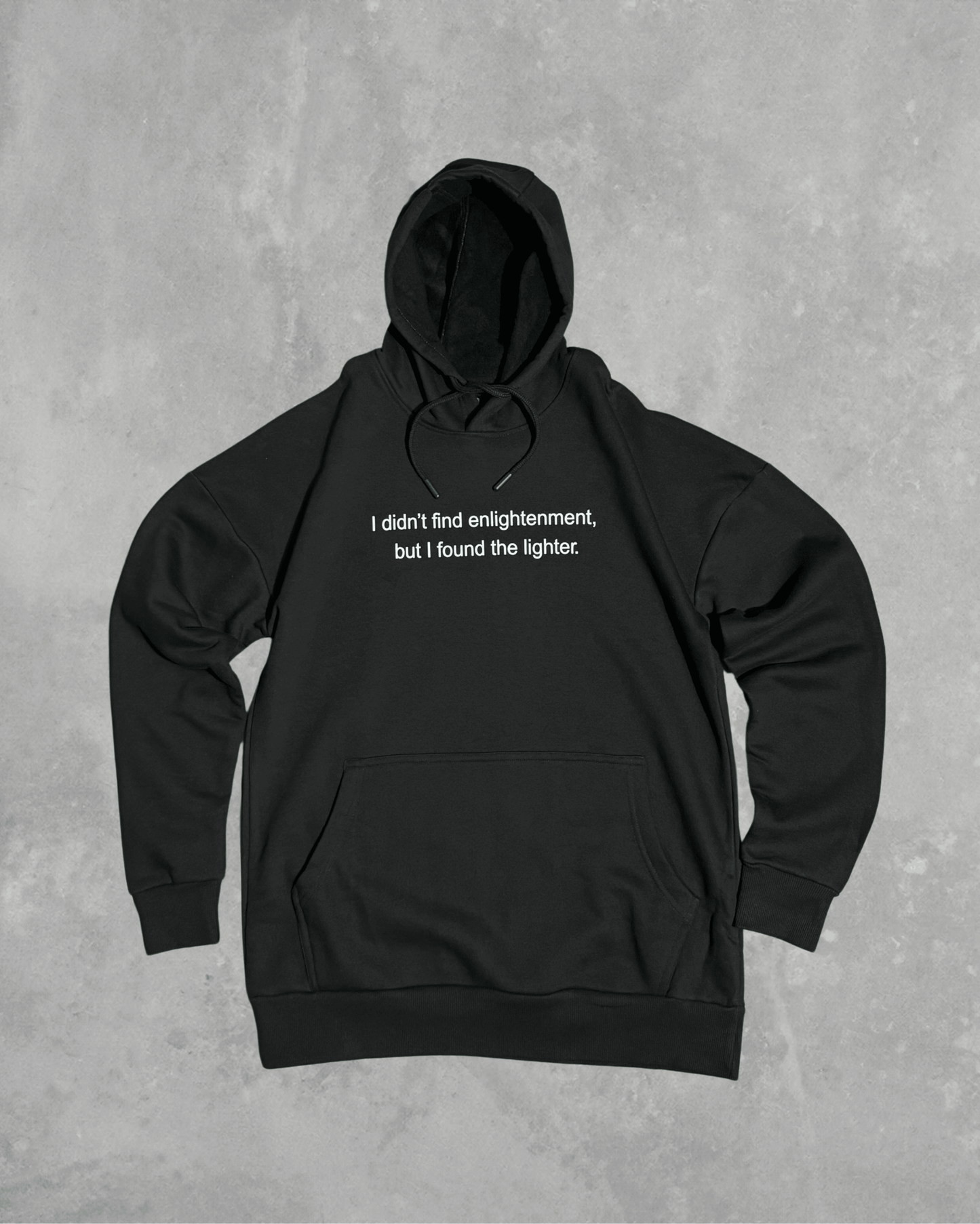 Black heavyweight hoodie with front text 'I didn't find enlightenment, but I found the lighter' – 400 GSM thick premium streetwear hoodie for men and women.