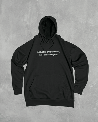 Black heavyweight hoodie with front text 'I didn't find enlightenment, but I found the lighter' – 400 GSM thick premium streetwear hoodie for men and women.