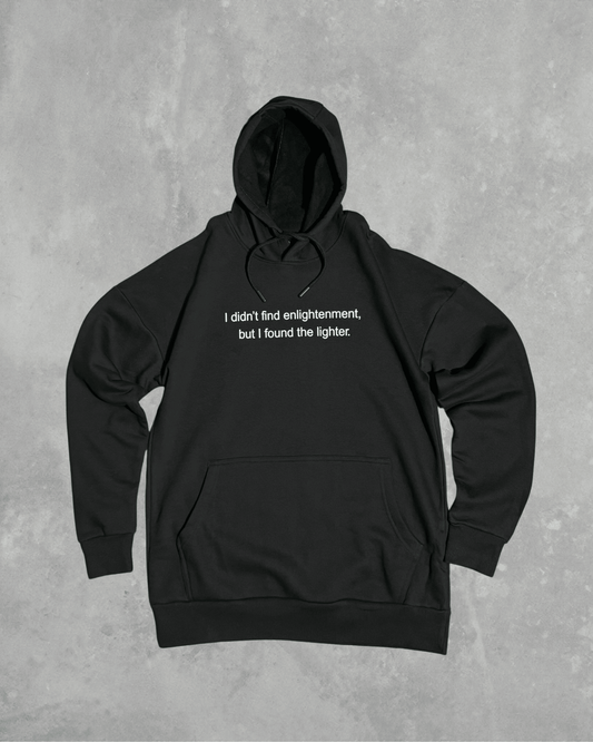 Black heavyweight hoodie with front text 'I didn't find enlightenment, but I found the lighter' – 400 GSM thick premium streetwear hoodie for men and women.