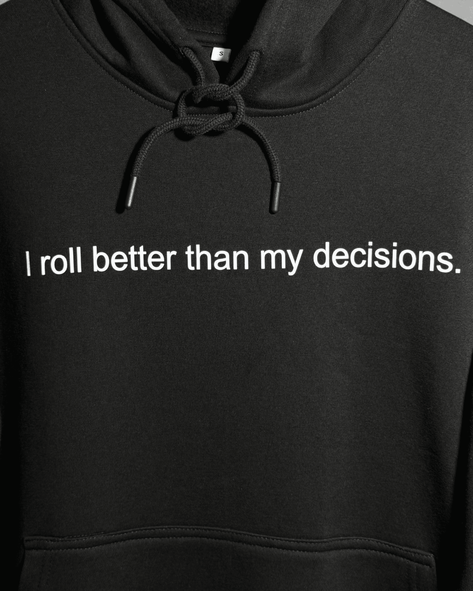 Black heavyweight hoodie with front text 'I roll better than my decisions' – 400 GSM thick premium streetwear hoodie for men and women - zoomed in.