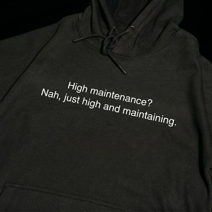 Black thick hoodie with text 'High maintenance? Nah, just high and maintaining'  – 400 GSM premium streetwear hoodie for men and women.
